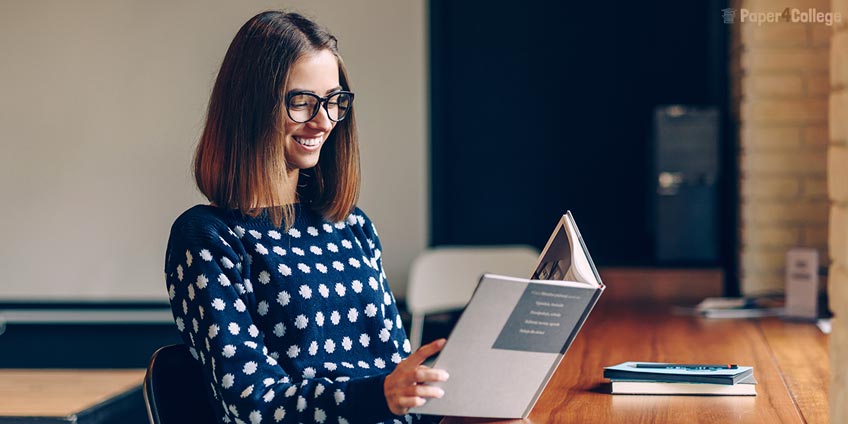 Smiling Girl with Sketchbook