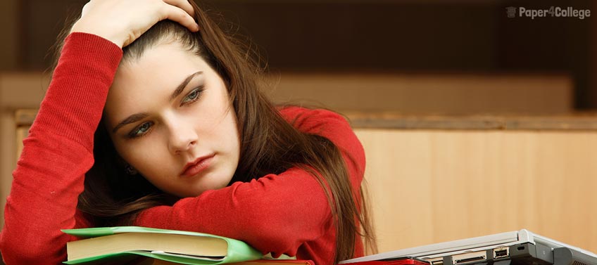 Student Sitting Inside an Empty Classroom