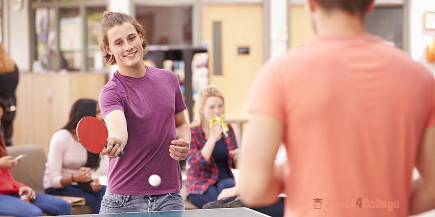 Two Students Playing Table Tennis